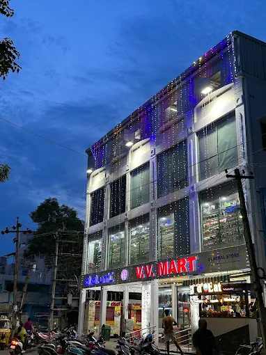 Wide grocery aisle with toiletries and snacks at V.V Mart Nanganallur